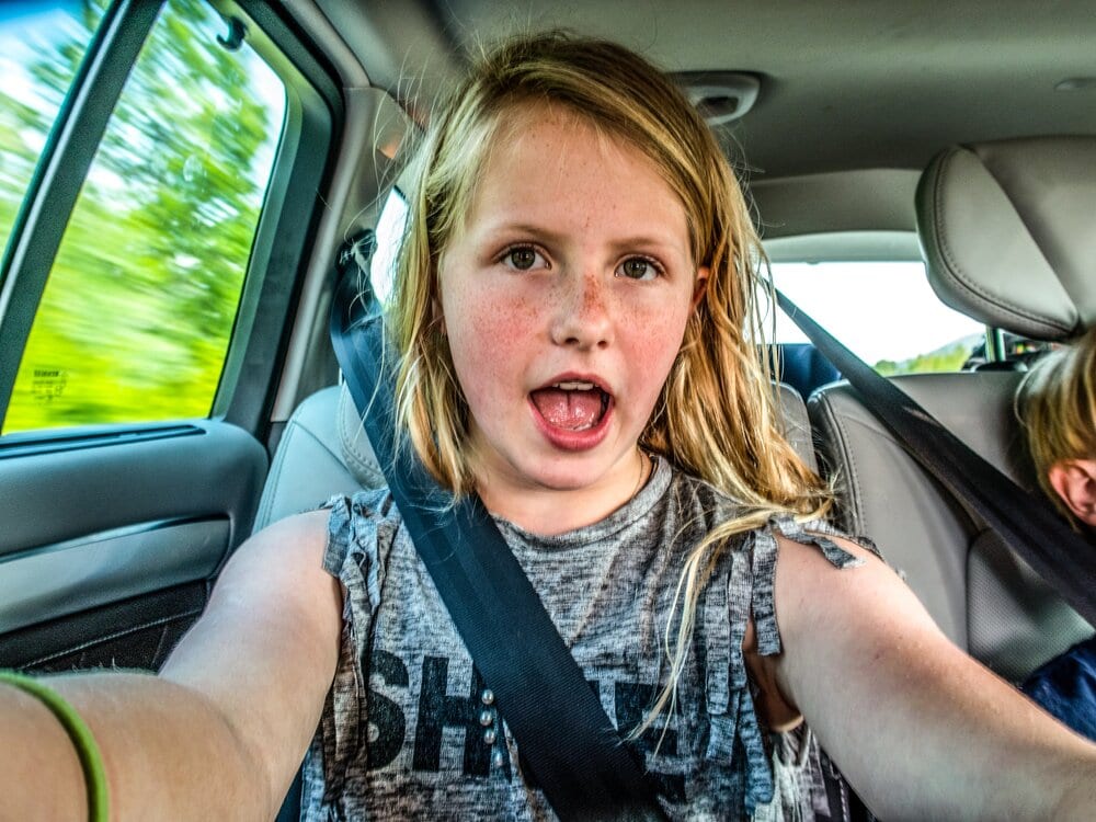 my oldest daughter took a selfie in the car