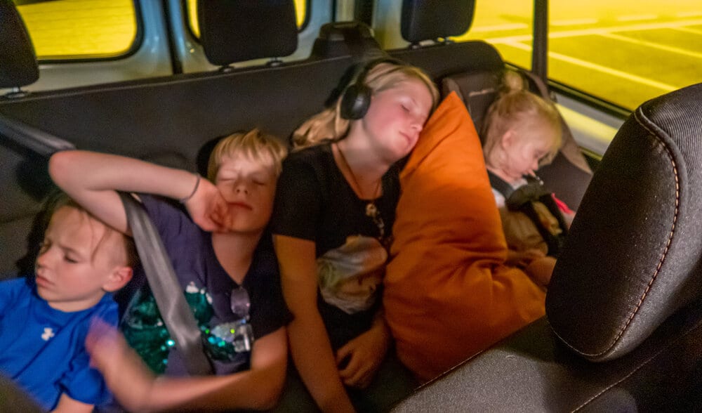 4 of my kids sleeping in the back of the van