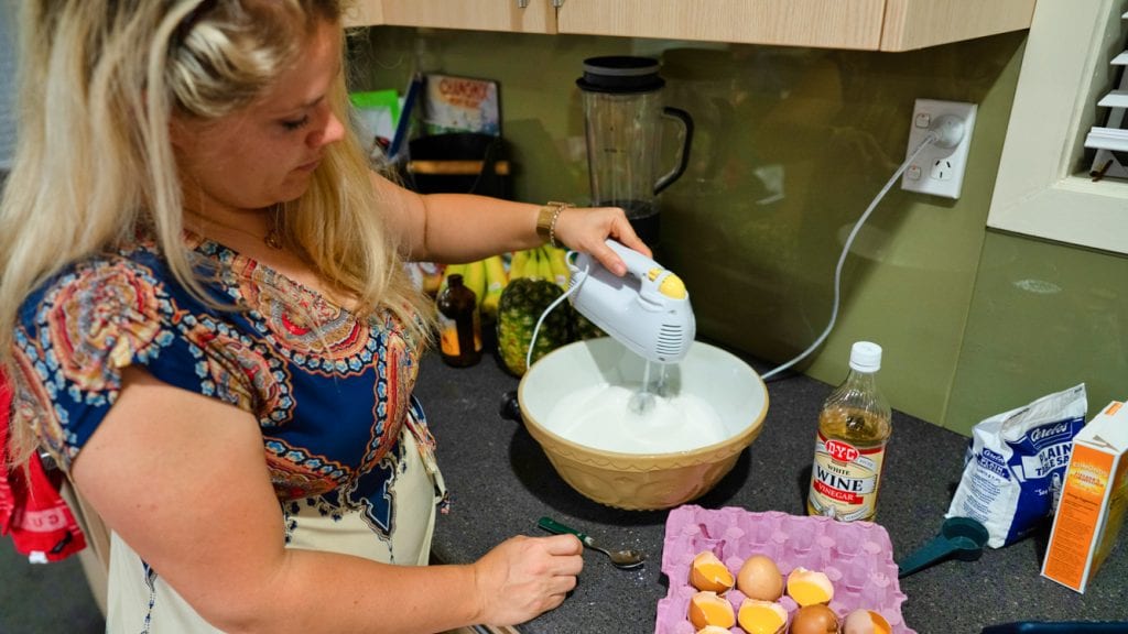 Leslie whipping the cream for the top of the Pavlova