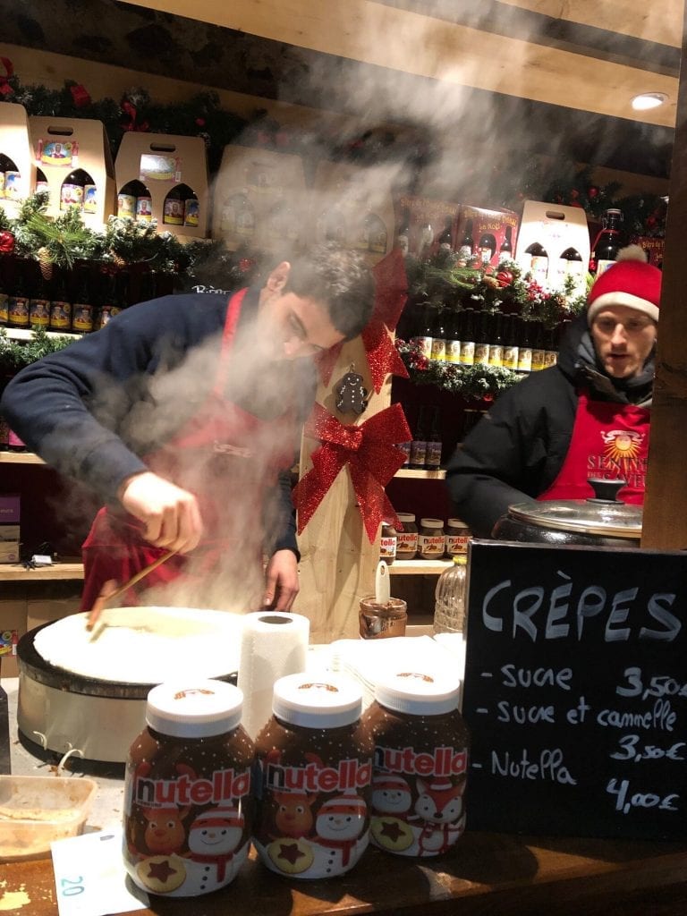 Christmas Markets in europe: food stand making crepes 