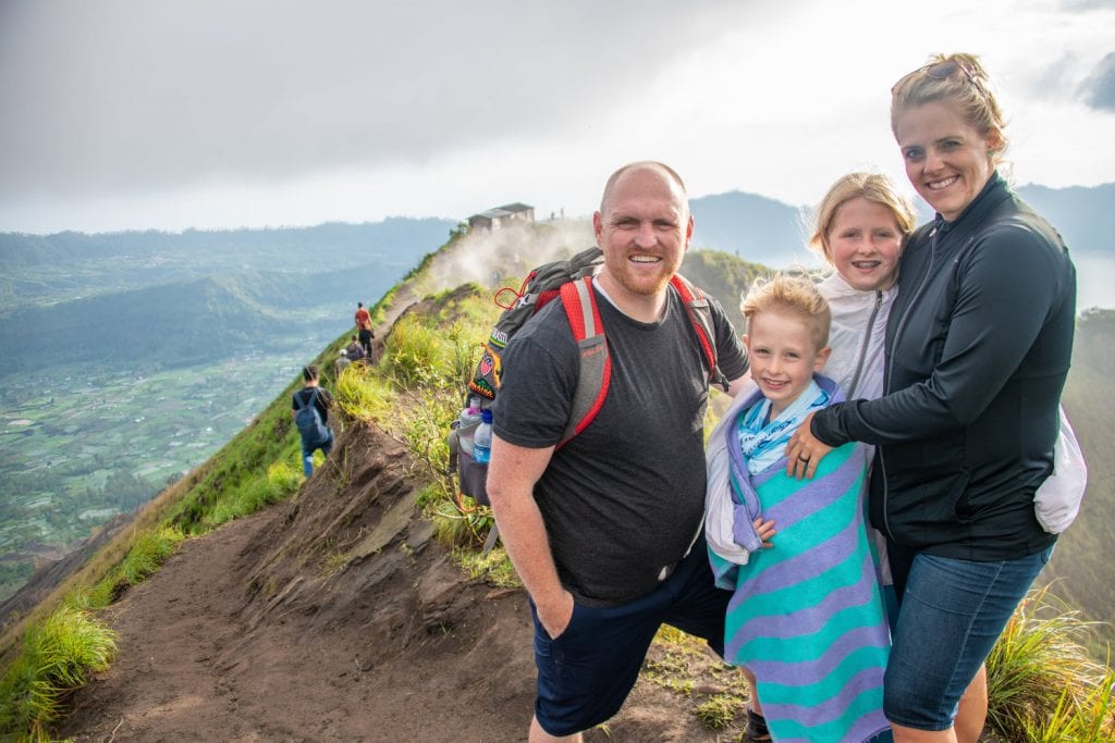 bali vacation- a family photo at the top of our sunrise hike