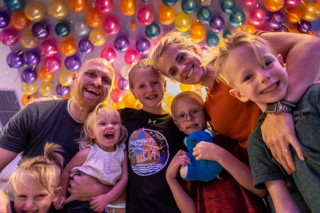 bangkok with kids- a family picture with a colorful balloon back drop