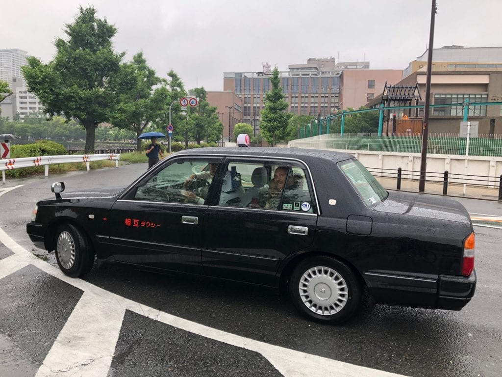 how to avoid scams- my family taking a Taxi in asia