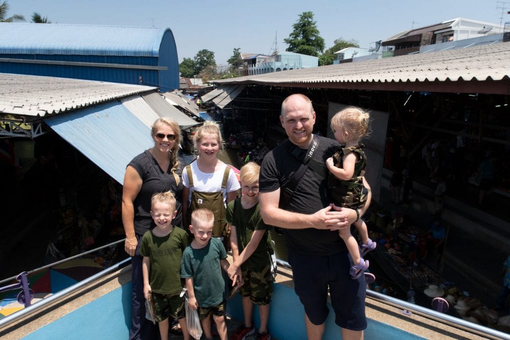 how to avoid scams- a family picture in Asia