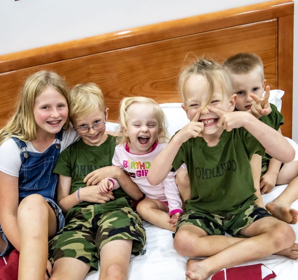 family travel- a silly photo of all my kids 