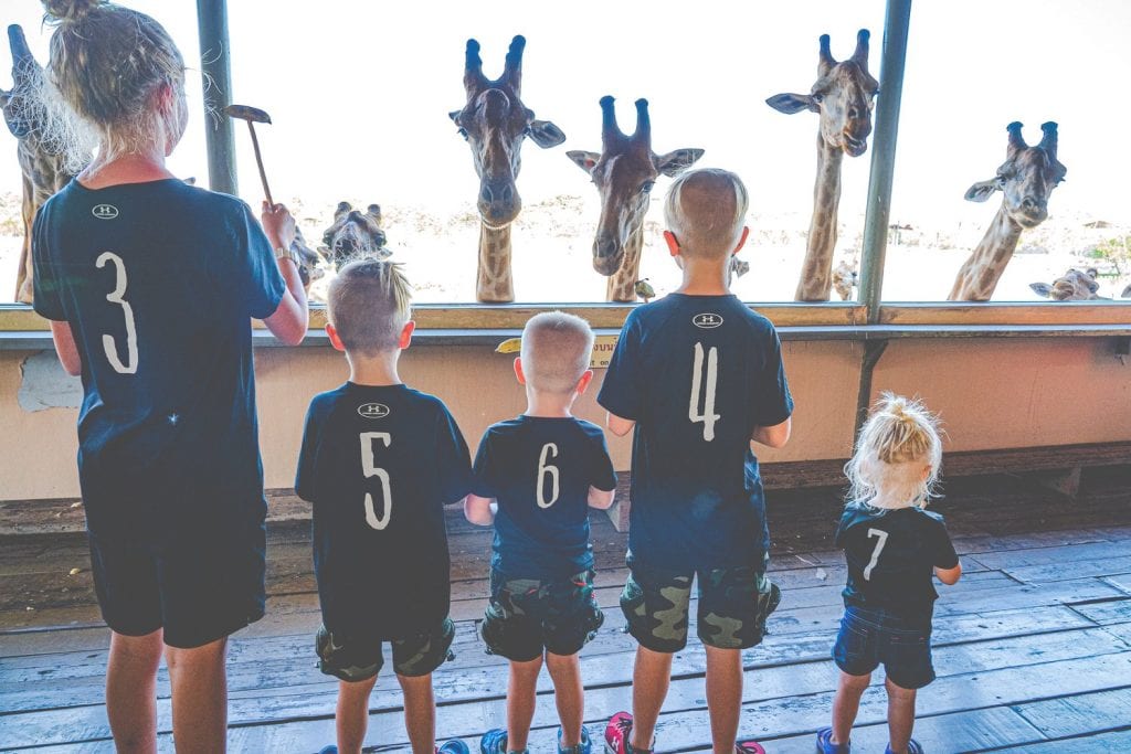 how to deal with homesickness- my kids looking at the giraffes at the zoo