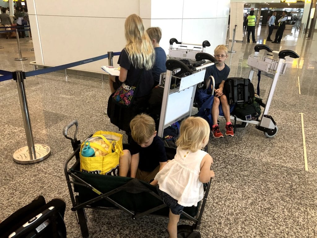 The kids piled into a wagon at the airport