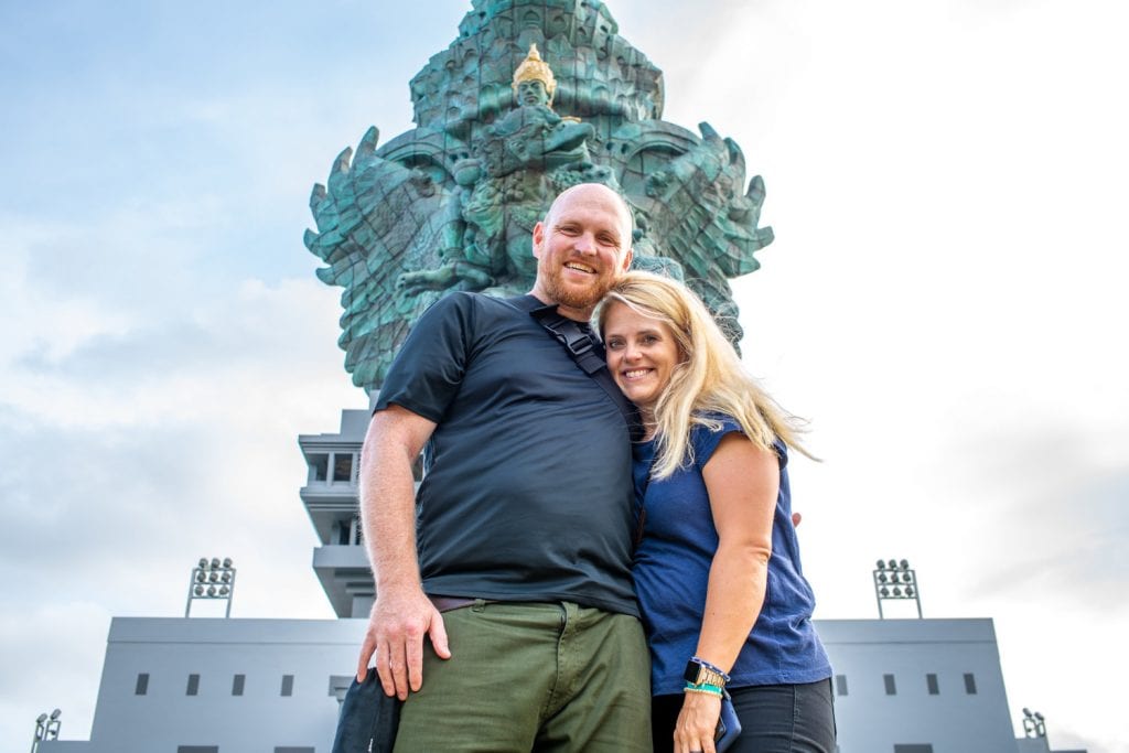 Chris and I in front of a statue in Bali 