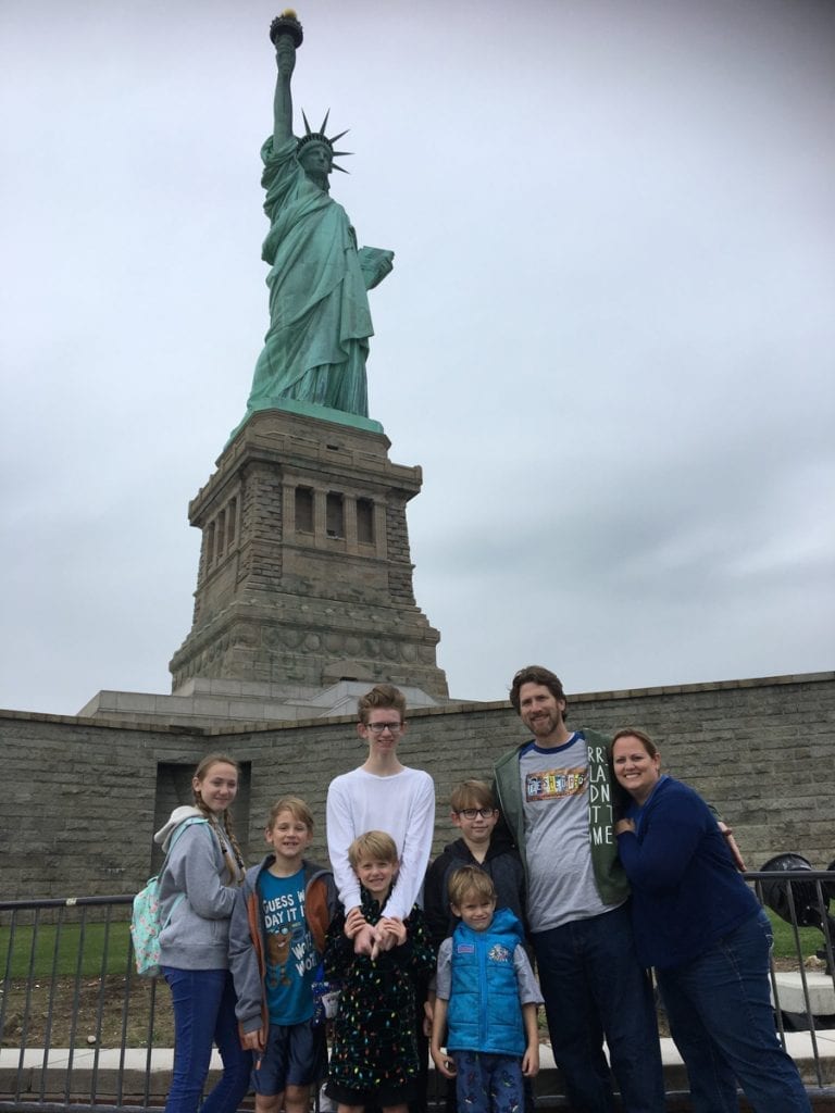 The Flory family in front of the Statue of Liberty