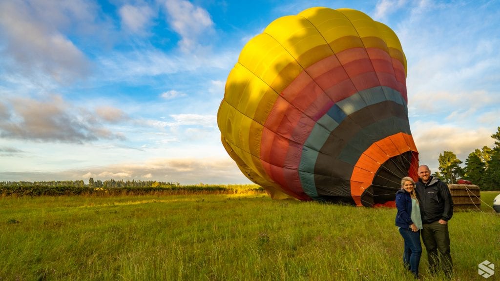 Chris and I in front of a hot air balloon that we rode in 