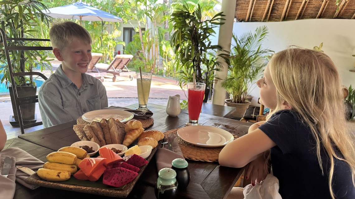 Breakfast smiles before a full day of adventures.
