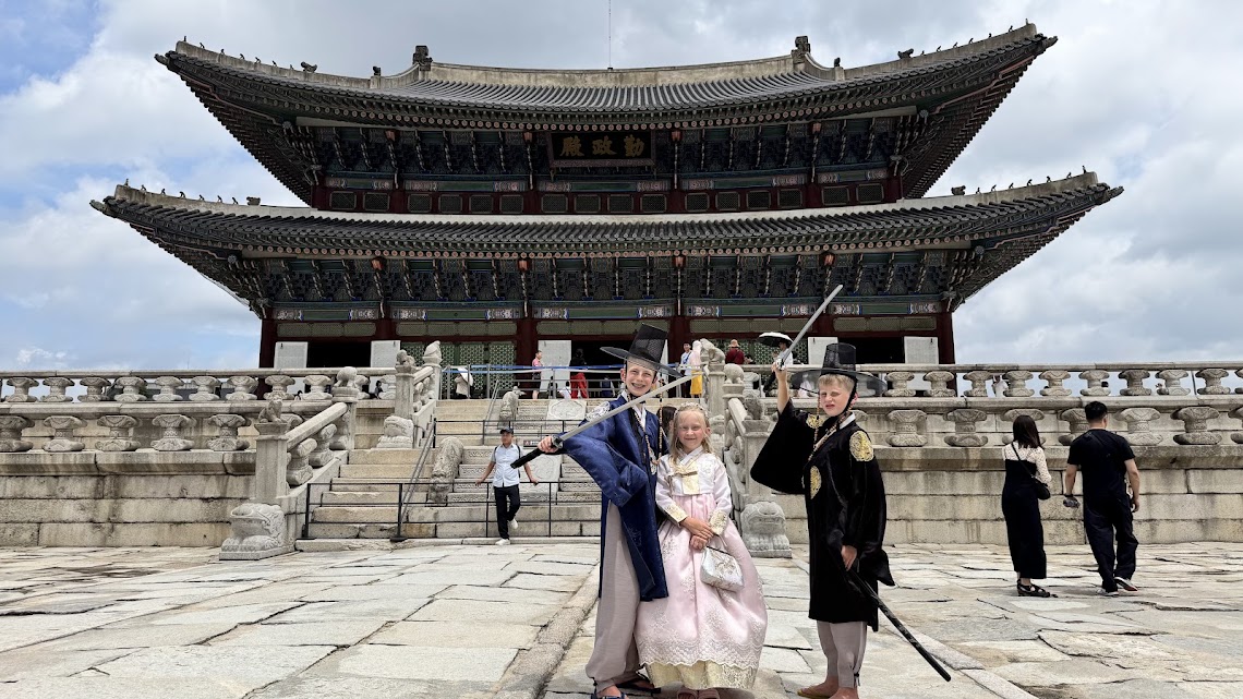 Harry, Grace, and Lincoln striking their royal poses at Gyeongbokgung Palace
