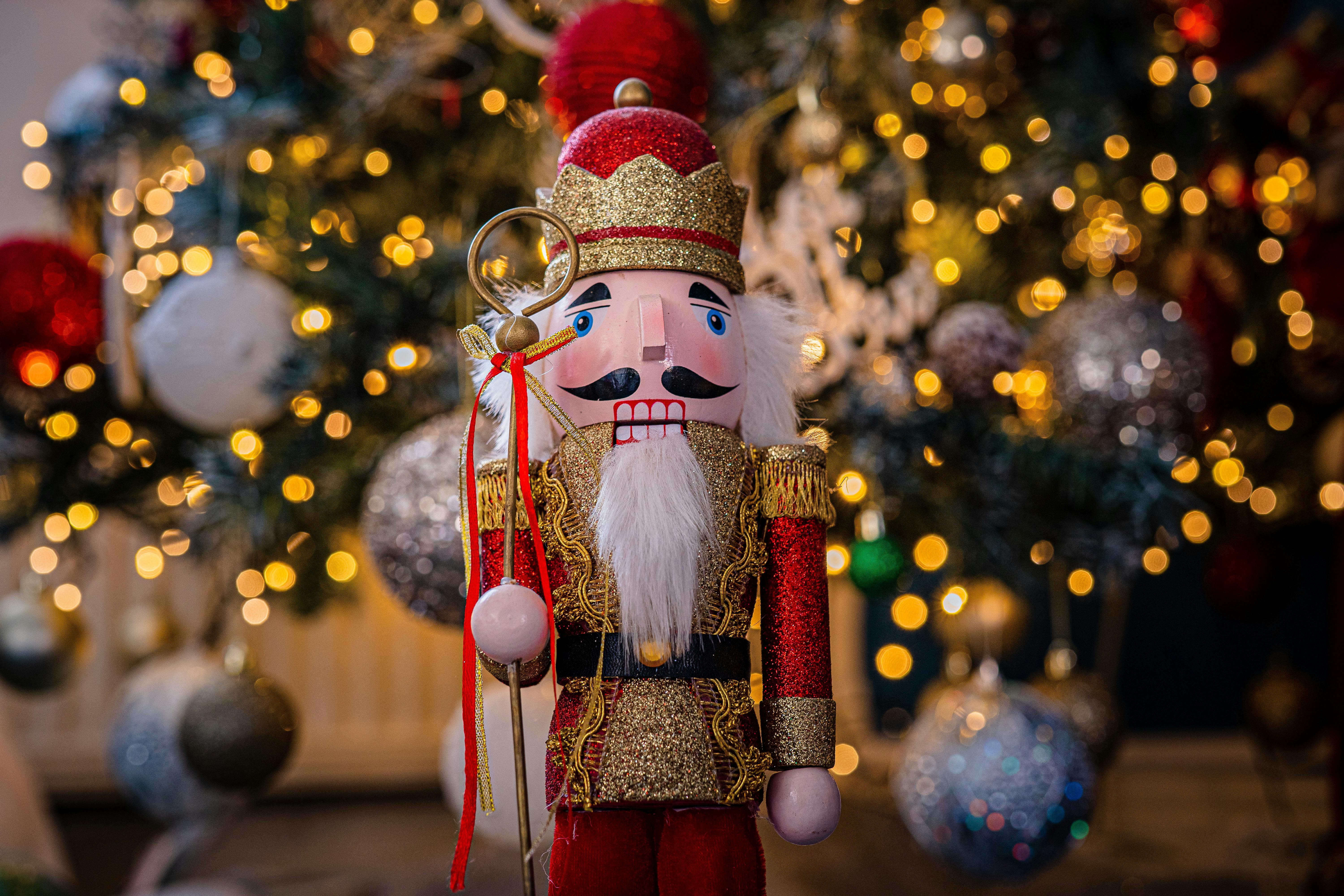Nutcracker figure, Christmas tree background
