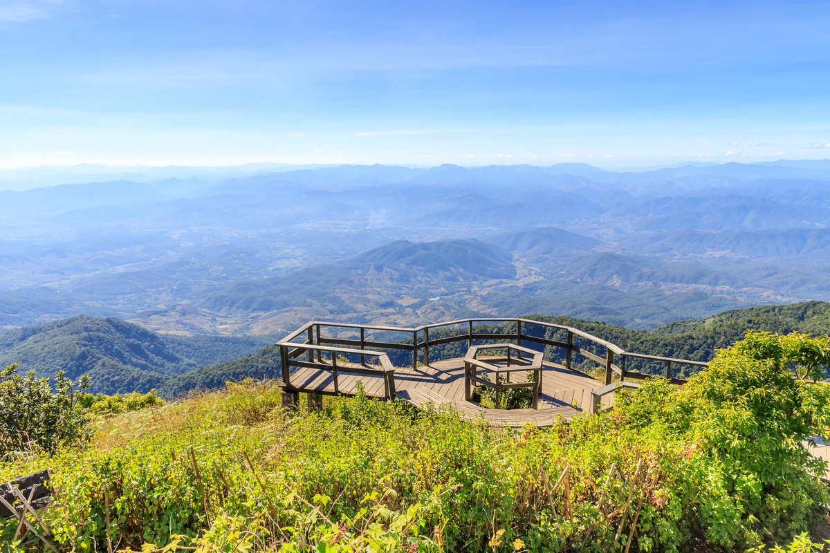 A viewing platform overlooks forested mountains at Doi Inthanon.